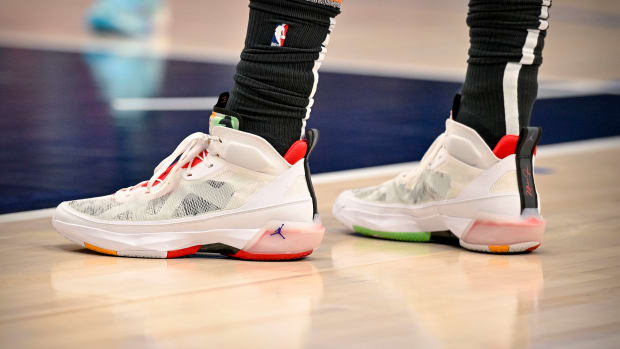 View of white and red Jordan shoes.